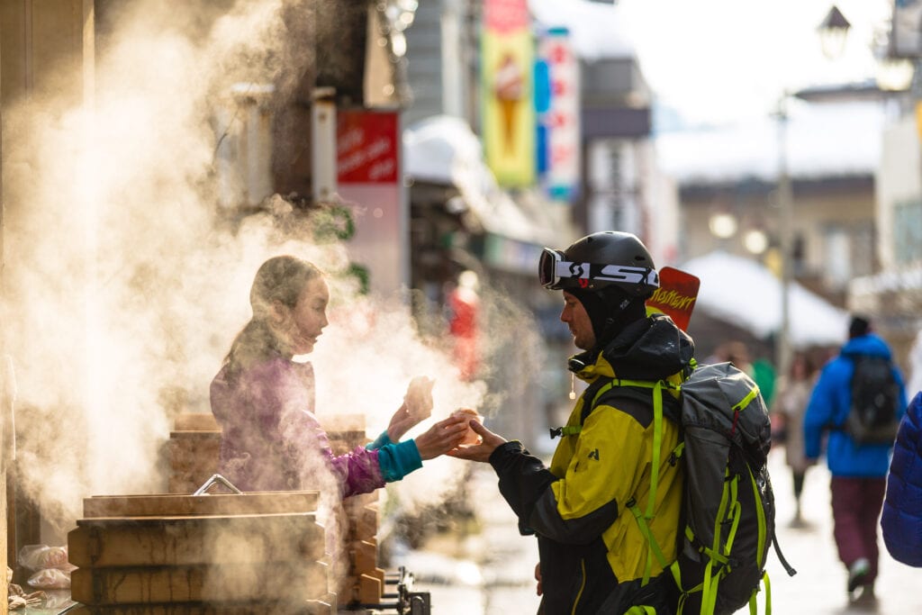 Skier KC Dean trying local cuisine in Japan Nozawa Onsen