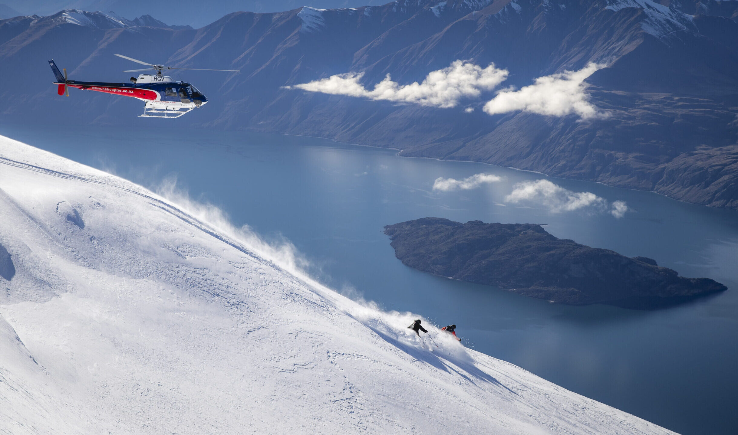 Mabey Ski Heli-skiing in Harris Mountains New Zealand towards lake.