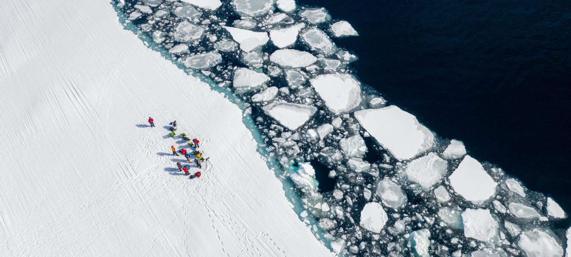 Guests gather at the arctic floe edge on Baffin Island